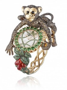 Timepiece from the Animal World collection, chimpanzee in 18ct rose gold set with brown diamonds, emeralds, tsavorites & reddish orange sapphires.