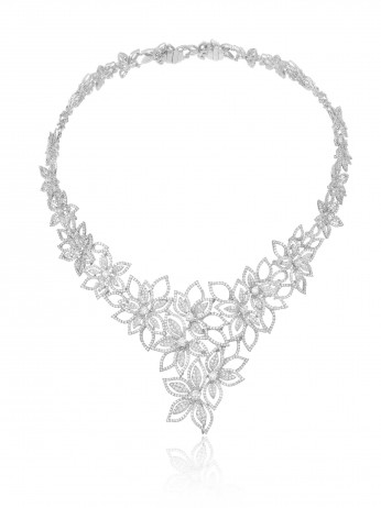 Necklace designed as an openwork garland of delicate diamond-set flowers.